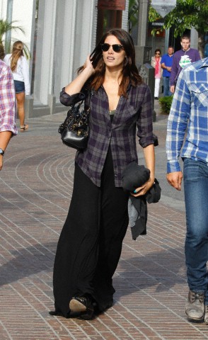 Ashley Greene and a male friend shop at The Grove in West Hollywood, California